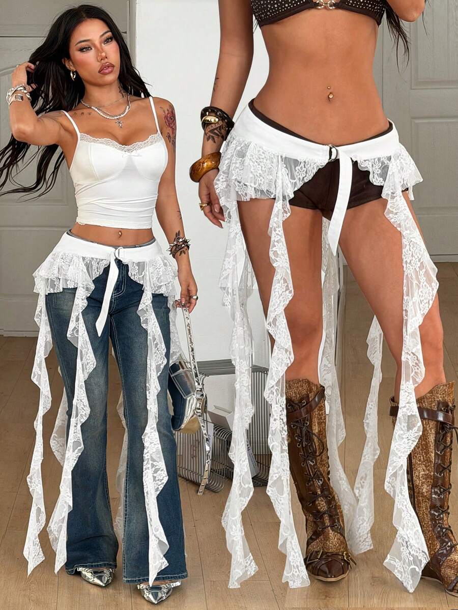 Women's black semi-sheer lace asymmetrical skirt with fringe details, contrast lace, low waist, and ruffle hem for beach, party, concert, or festival outfits.