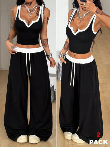 Women's black and white two-piece casual outfit featuring a colorblock notched camisole tank top and matching extra-long drawstring pants.