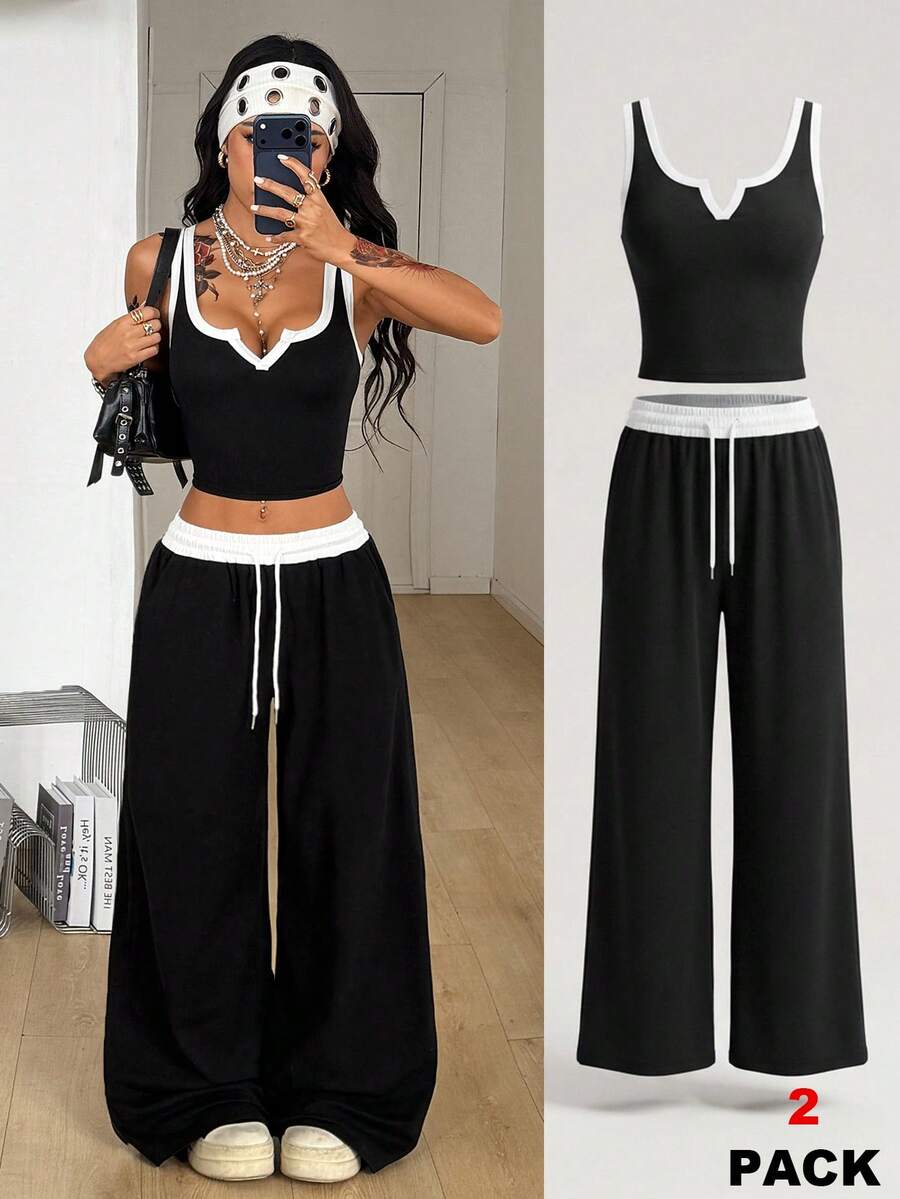 Women's black and white two-piece casual outfit featuring a colorblock notched camisole tank top and matching extra-long drawstring pants.