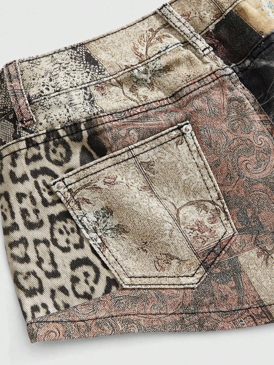 Vintage animal print ultra low waist mini shorts featuring button zipper closure, pockets, and regular fit.