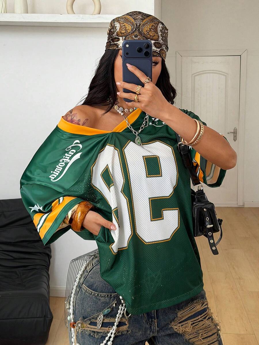 Green short sleeve graphic jersey t-shirt with V-neck and oversized fit