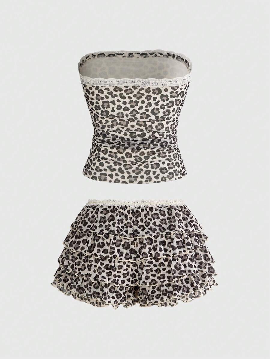 Y2K leopard print two-piece outfit with strapless bandeau top and ruffle mini shorts, featuring contrast lace and a slim fit