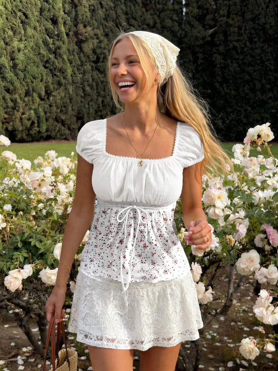 White ditsy floral women's square neck short sleeve t-shirt featuring puff sleeves, frill details, and a slim fit flared hem.