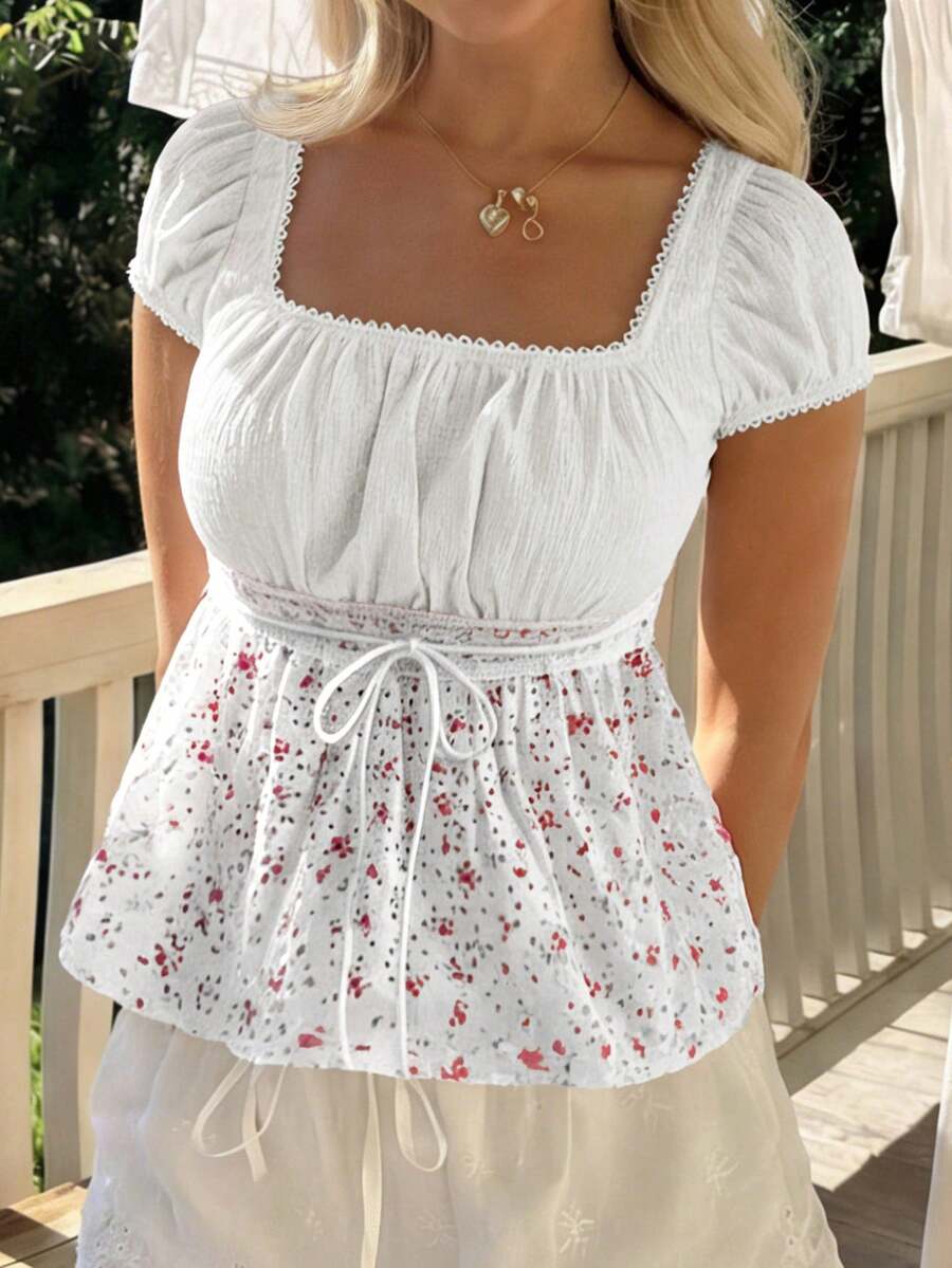 White ditsy floral women's square neck short sleeve t-shirt featuring puff sleeves, frill details, and a slim fit flared hem.