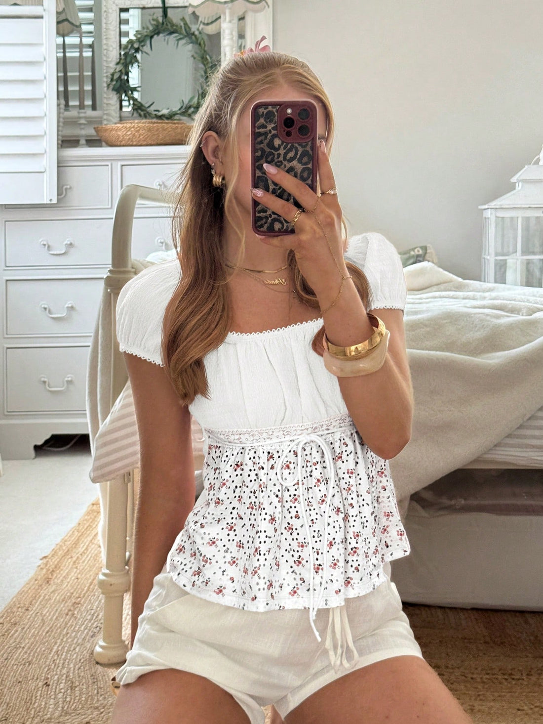 White ditsy floral women's square neck short sleeve t-shirt featuring puff sleeves, frill details, and a slim fit flared hem.