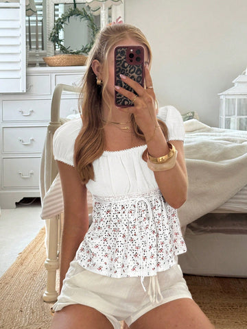 White ditsy floral women's square neck short sleeve t-shirt featuring puff sleeves, frill details, and a slim fit flared hem.