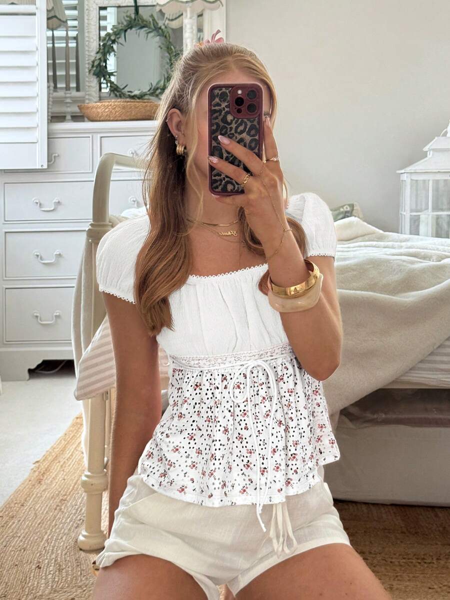 White ditsy floral women's square neck short sleeve t-shirt featuring puff sleeves, frill details, and a slim fit flared hem.