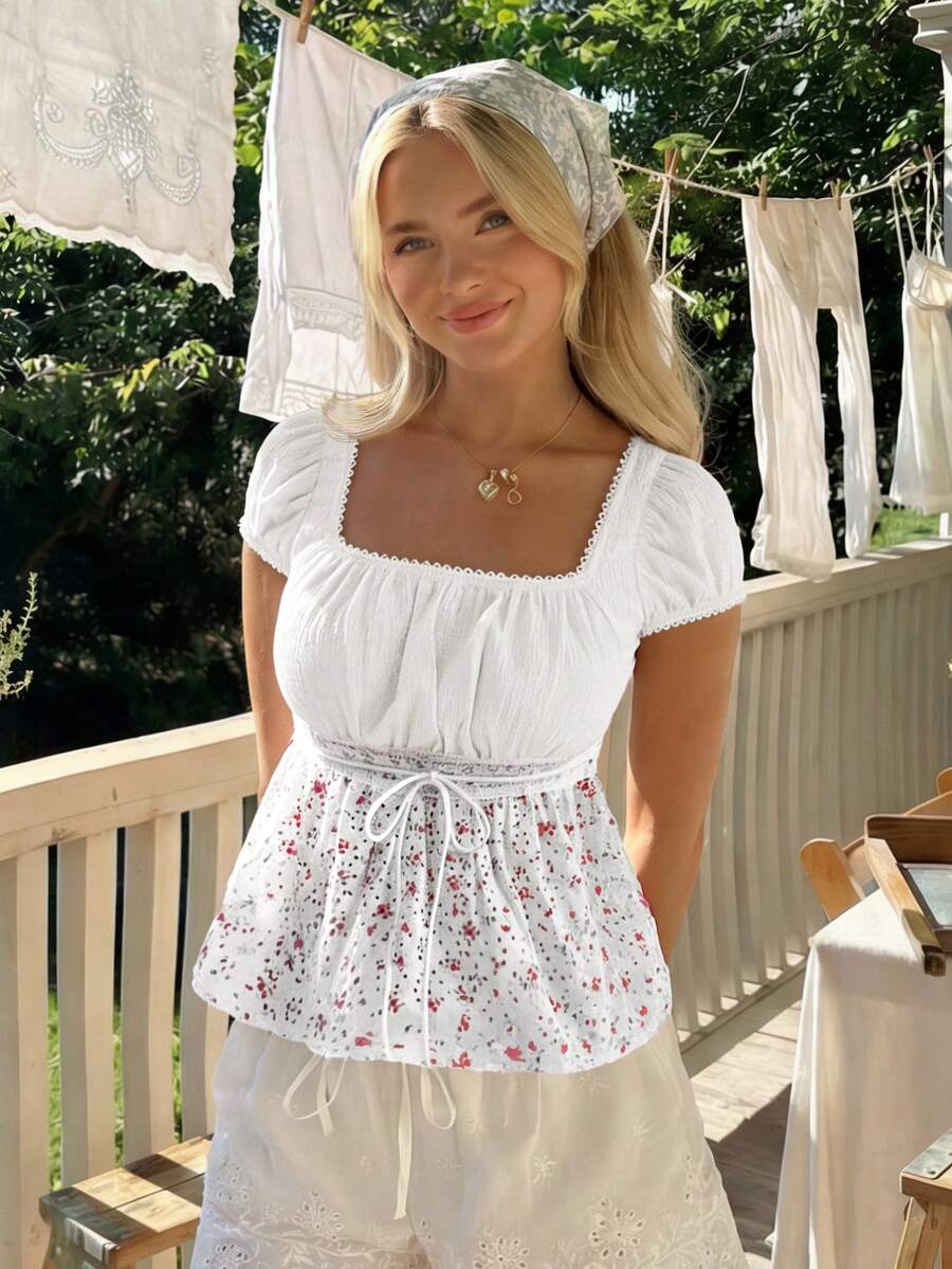 White ditsy floral women's square neck short sleeve t-shirt featuring puff sleeves, frill details, and a slim fit flared hem.