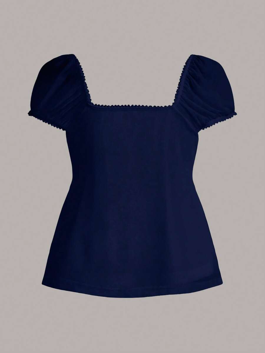 Women's black short puff sleeve top featuring a square neckline, ruched bust detail, and flared ruffle hem.