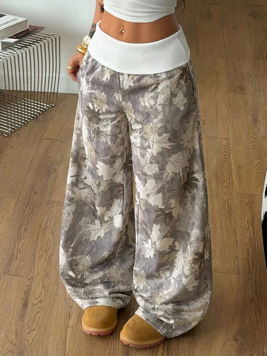 Women's wide leg trousers with a tree branch graphic pattern, loose fit, and mid-rise waist in woven fabric.