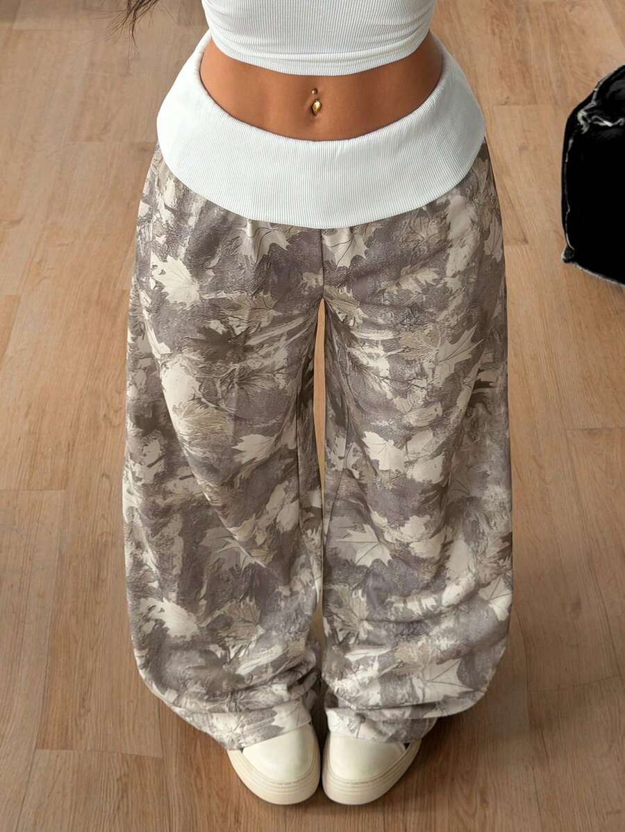 Women's wide leg trousers with a tree branch graphic pattern, loose fit, and mid-rise waist in woven fabric.