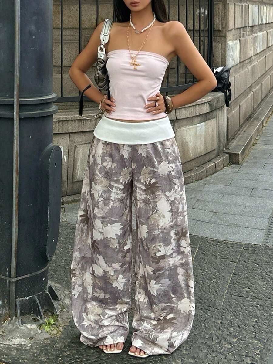 Women's wide leg trousers with a tree branch graphic pattern, loose fit, and mid-rise waist in woven fabric.