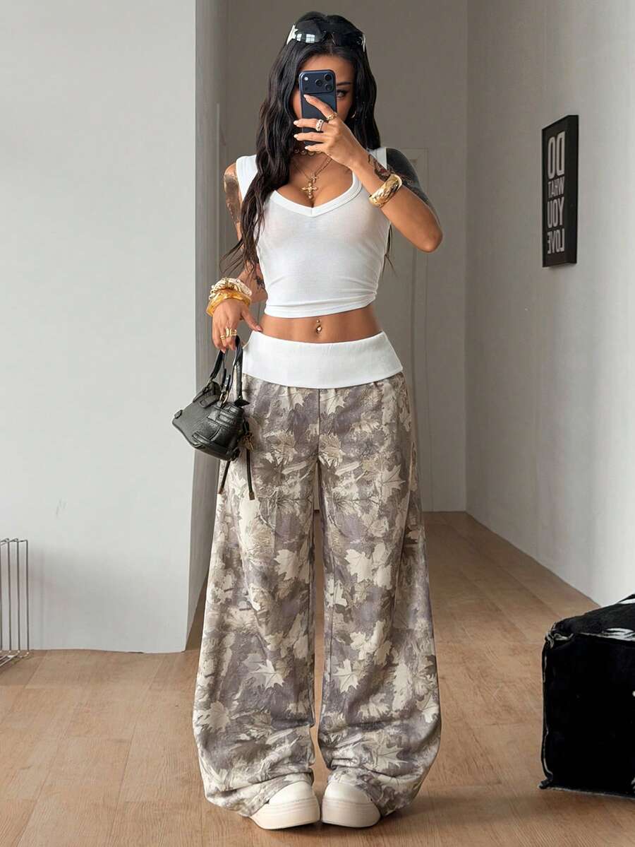 Women's wide leg trousers with a tree branch graphic pattern, loose fit, and mid-rise waist in woven fabric.