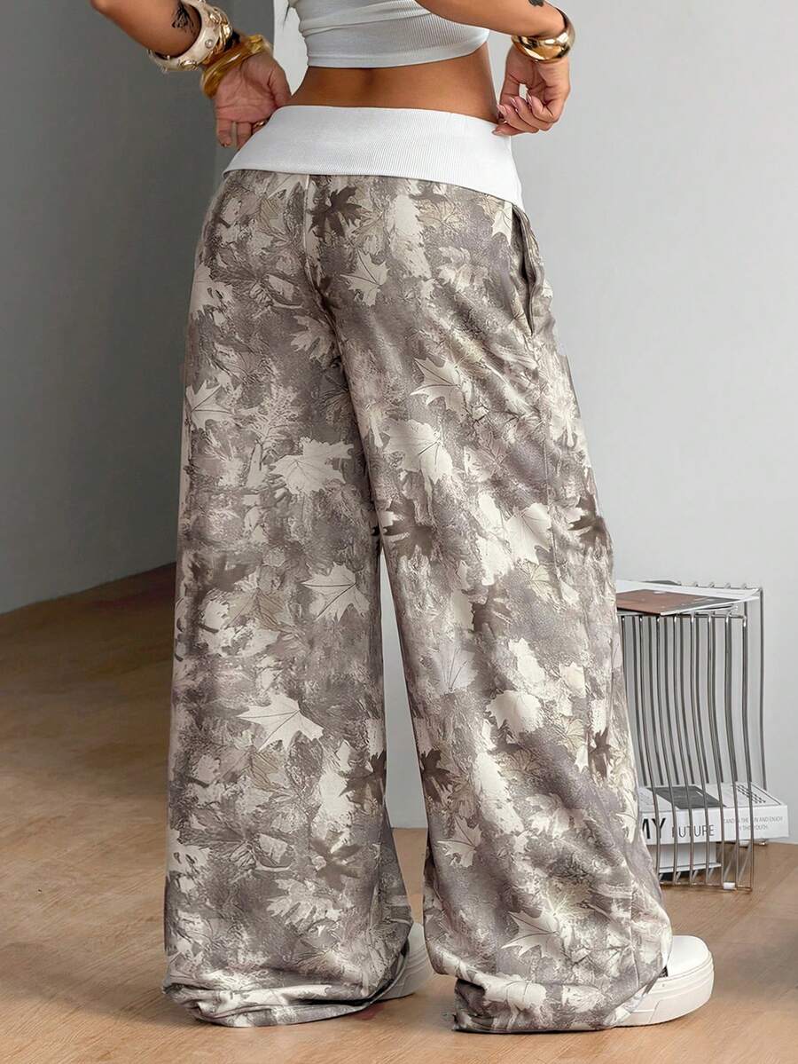 Women's wide leg trousers with a tree branch graphic pattern, loose fit, and mid-rise waist in woven fabric.