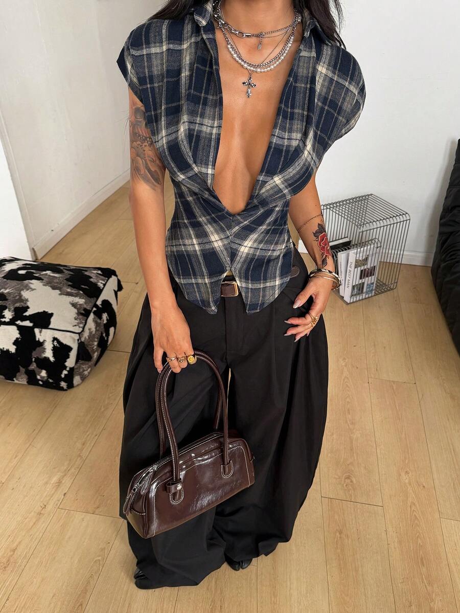 Women's plaid short sleeve shirt featuring a lapel collar and backless design in woven fabric.