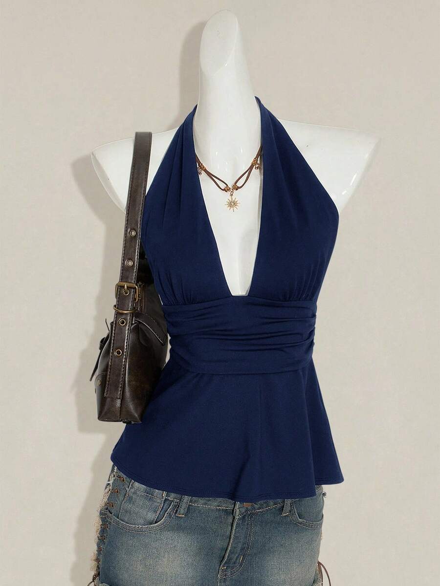 Women's backless halter babydoll tank top featuring a square neckline, slim fit silhouette, and a flared ruffle hem.
