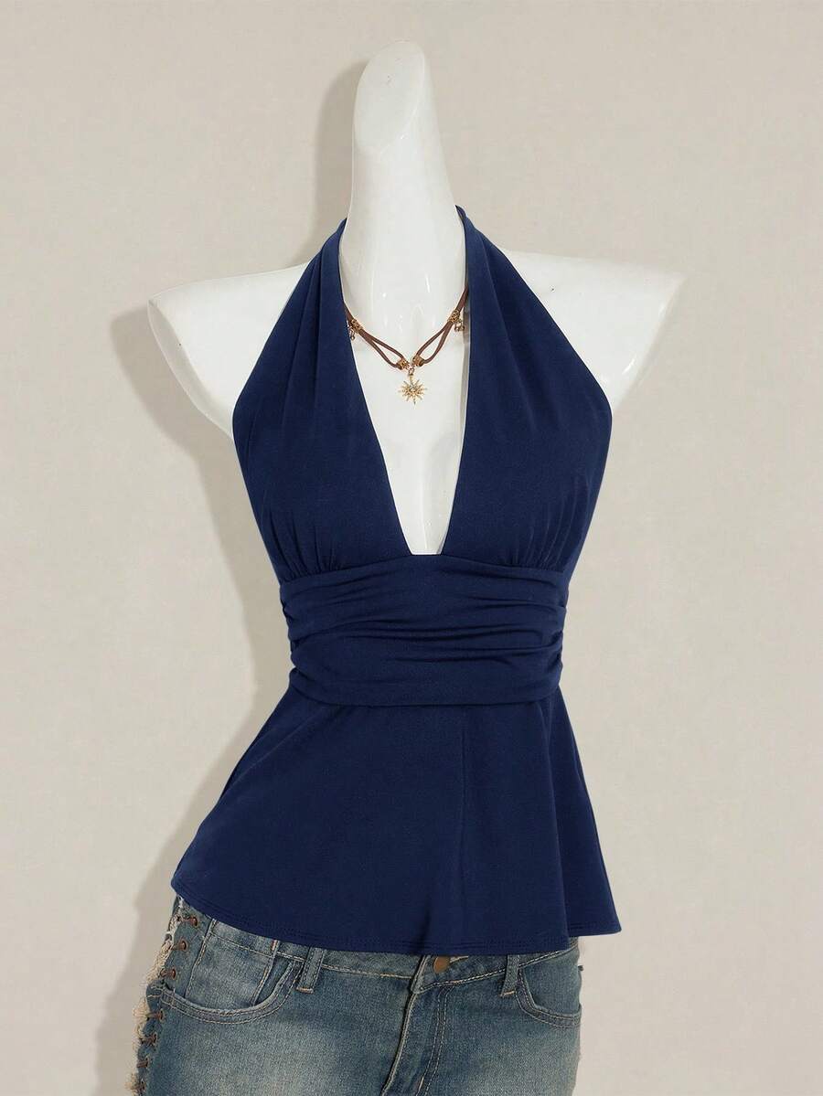 Women's backless halter babydoll tank top featuring a square neckline, slim fit silhouette, and a flared ruffle hem.