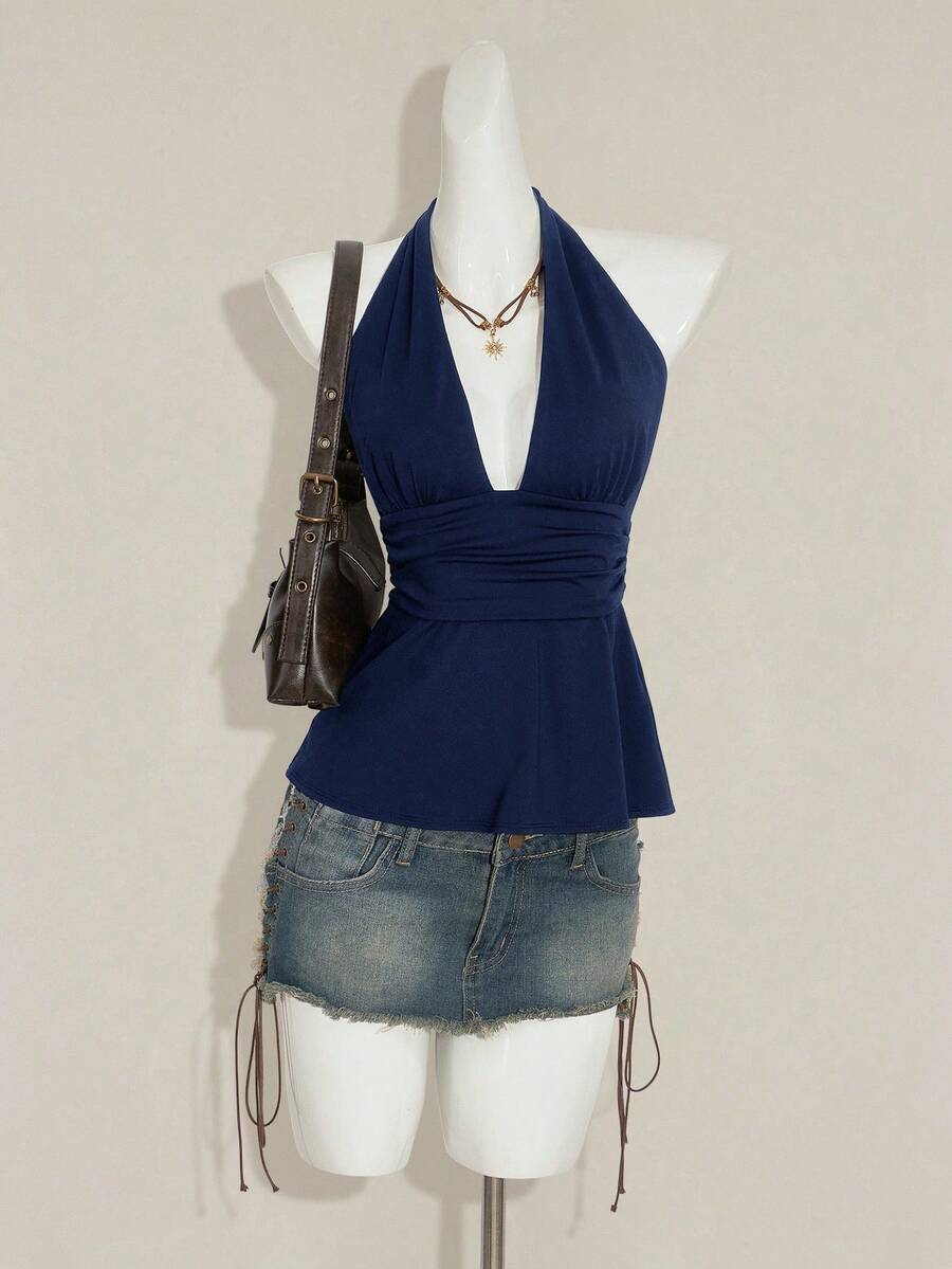 Women's backless halter babydoll tank top featuring a square neckline, slim fit silhouette, and a flared ruffle hem.