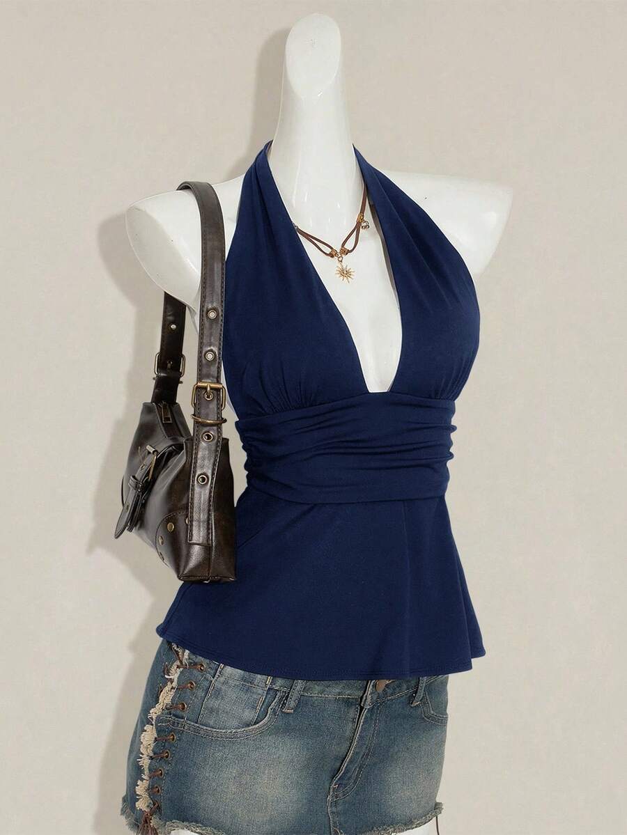 Women's backless halter babydoll tank top featuring a square neckline, slim fit silhouette, and a flared ruffle hem.