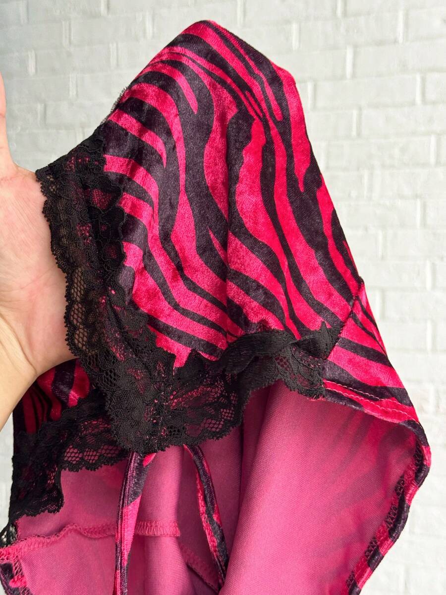 Multicolor sleeveless halter mini dress with sequin velvet leopard print patchwork, lace trim, cut-out detail, slim fit silhouette, and pencil hem