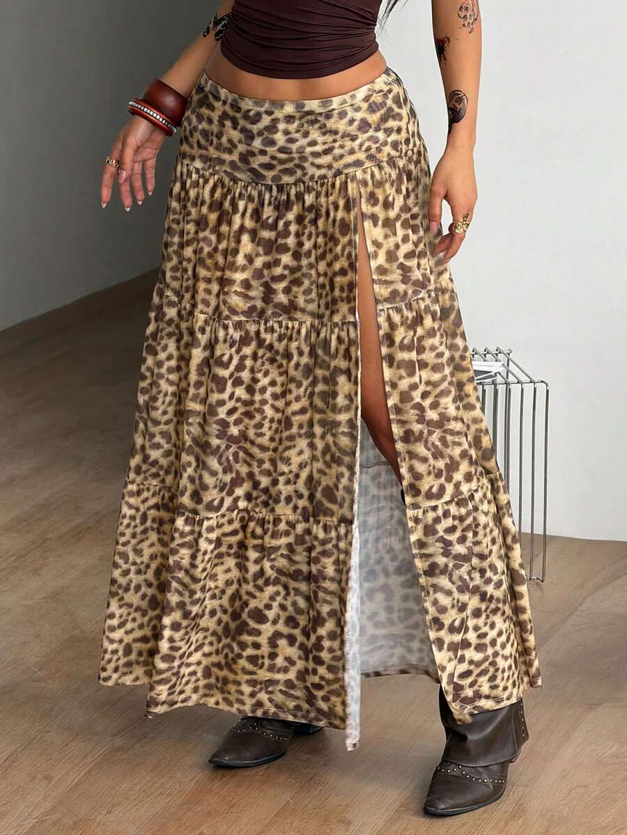 Women's low rise flared long skirt featuring an all-over print, split thigh accent, and textured semi-sheer fabric.