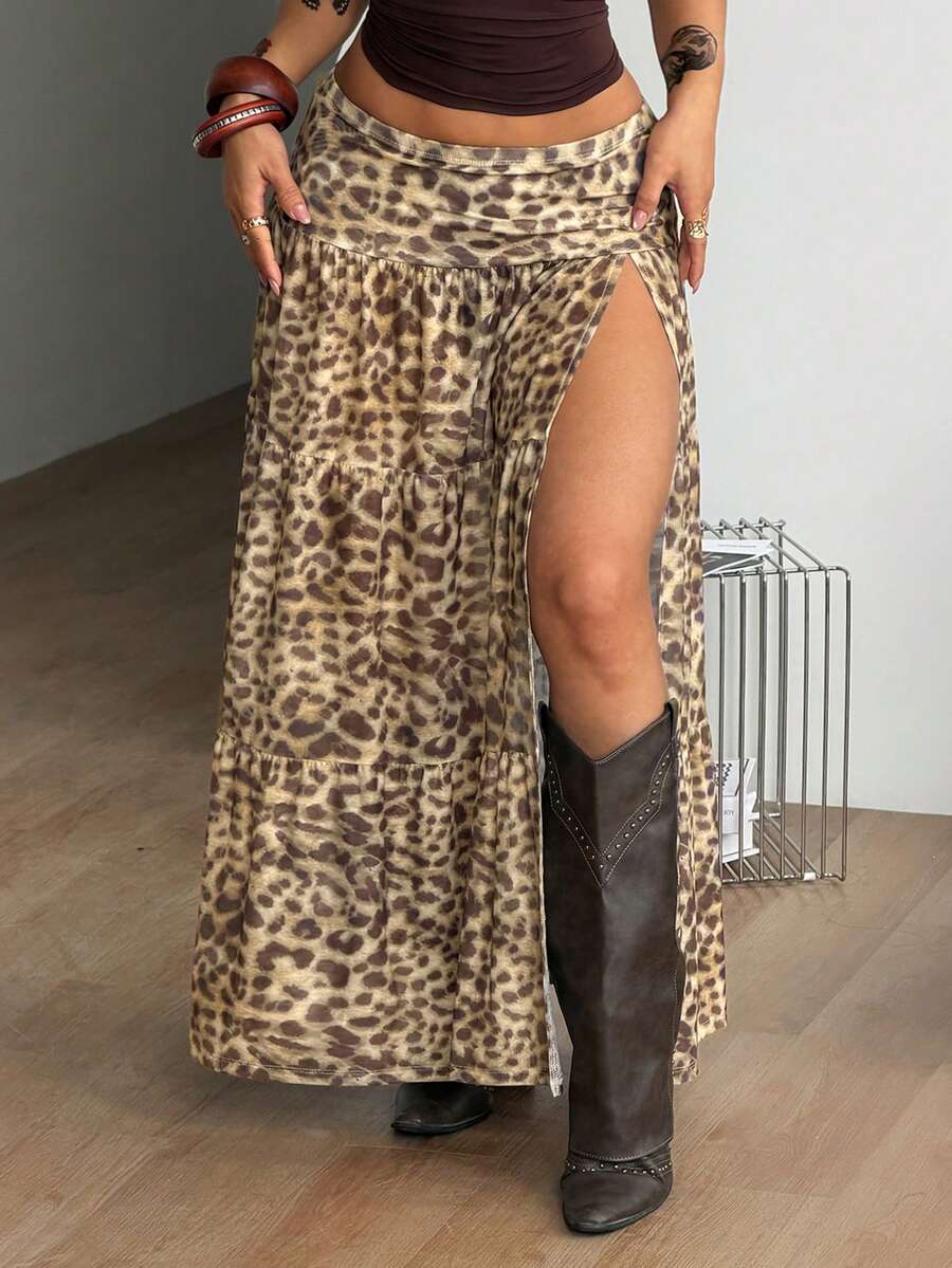 Women's low rise flared long skirt featuring an all-over print, split thigh accent, and textured semi-sheer fabric.