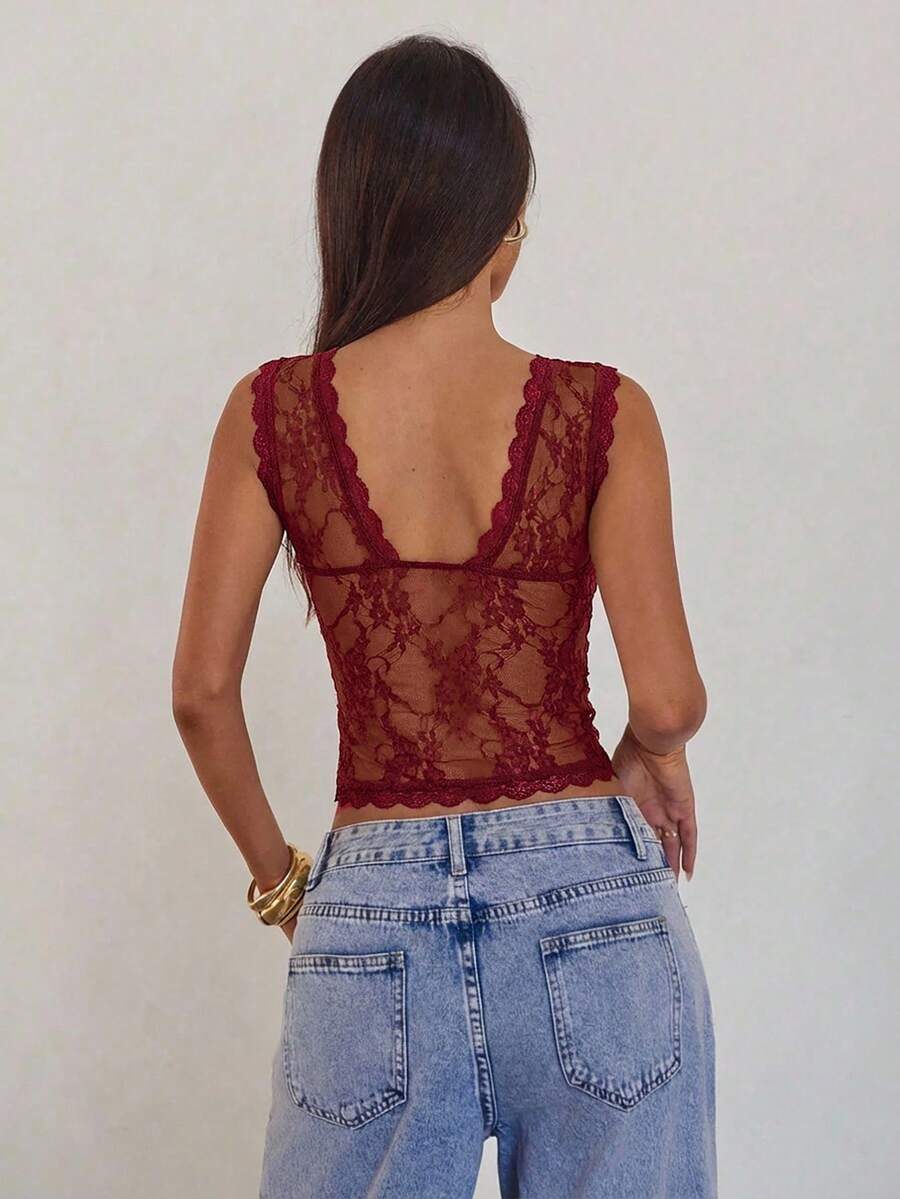Women's sleeveless lace tank top with a V-neck, contrast lace trim, plant pattern embroidery, and a backless design.