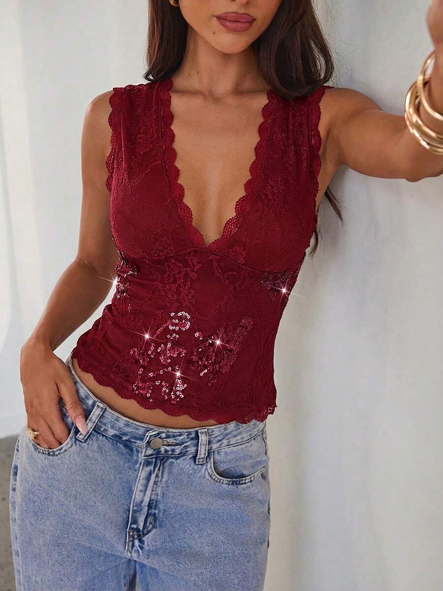 Women's sleeveless lace tank top with a V-neck, contrast lace trim, plant pattern embroidery, and a backless design.