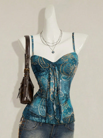 Women's green paisley print Y2K cami top with spaghetti straps, pleated styling, lace-up knot detail, and asymmetrical boho design.
