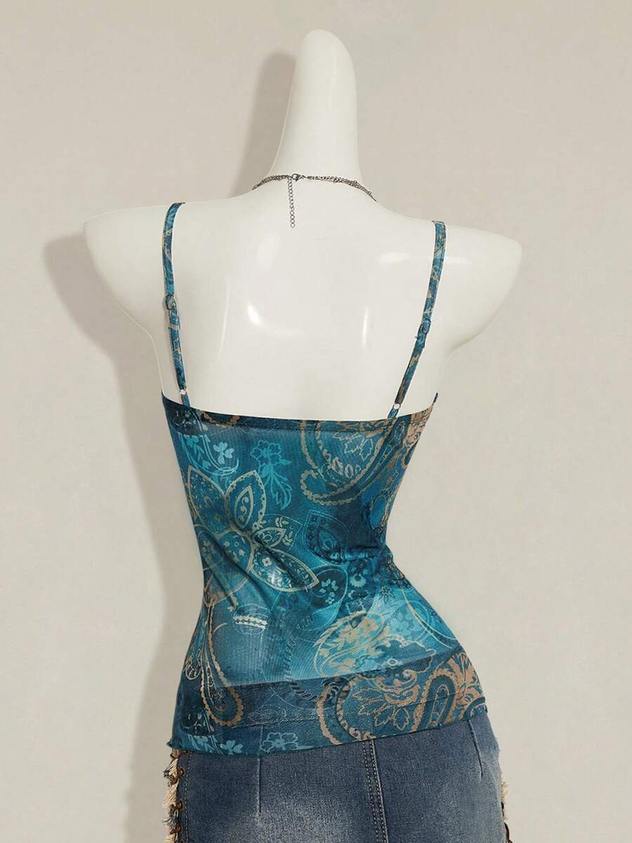 Women's green paisley print Y2K cami top with spaghetti straps, pleated styling, lace-up knot detail, and asymmetrical boho design.