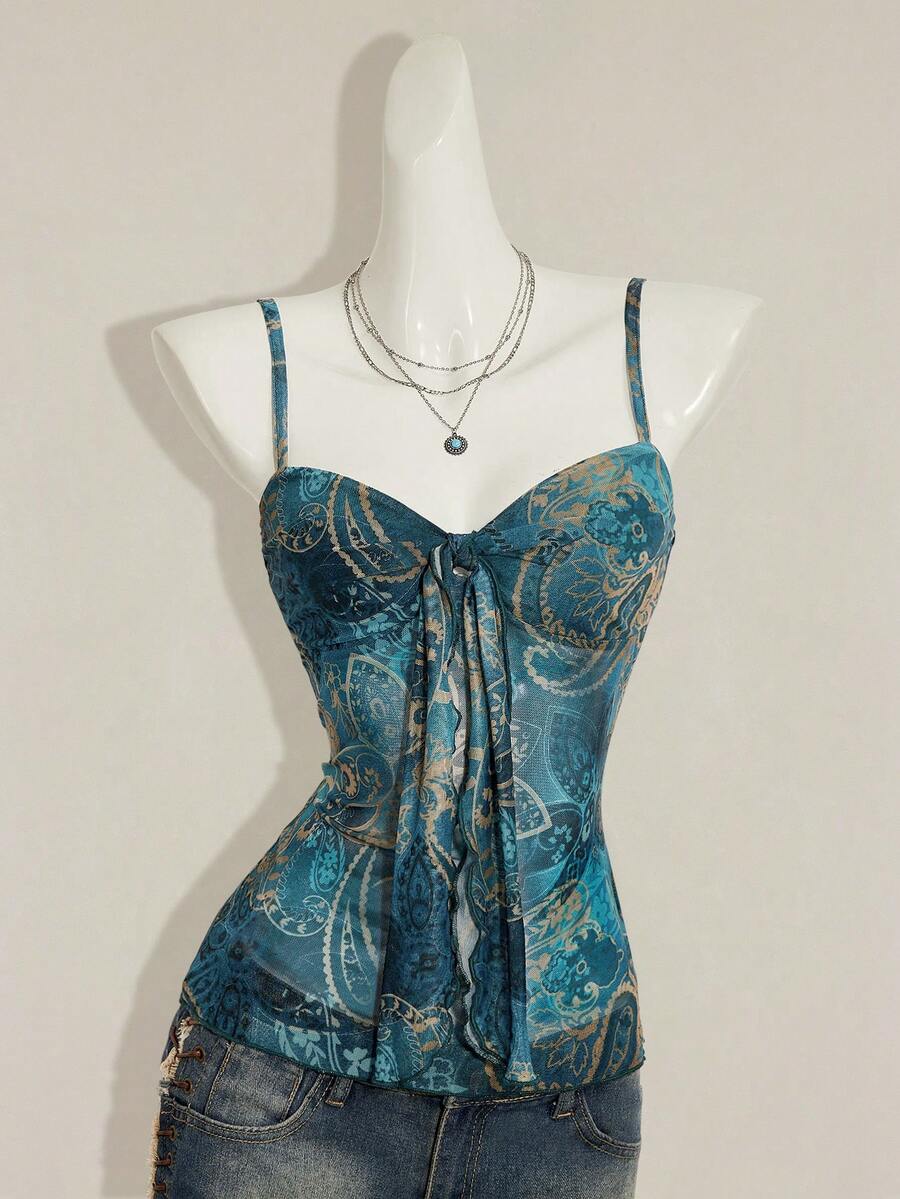 Women's green paisley print Y2K cami top with spaghetti straps, pleated styling, lace-up knot detail, and asymmetrical boho design.