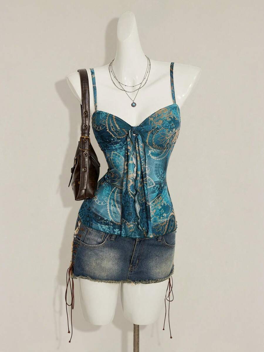 Women's green paisley print Y2K cami top with spaghetti straps, pleated styling, lace-up knot detail, and asymmetrical boho design.