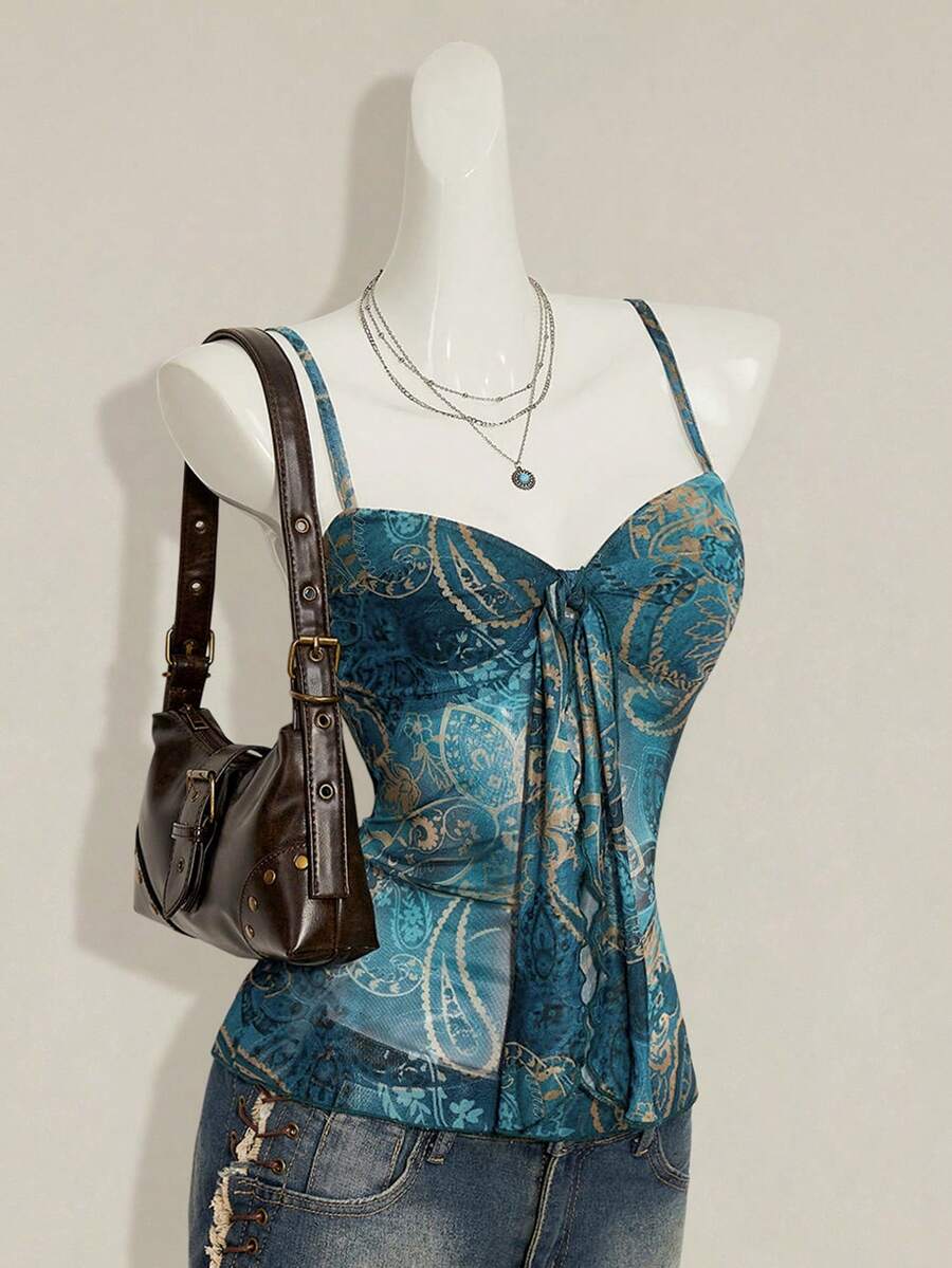 Women's green paisley print Y2K cami top with spaghetti straps, pleated styling, lace-up knot detail, and asymmetrical boho design.