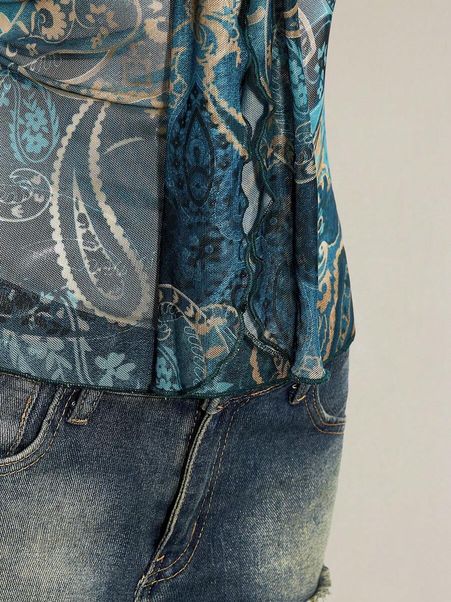 Women's green paisley print Y2K cami top with spaghetti straps, pleated styling, lace-up knot detail, and asymmetrical boho design.