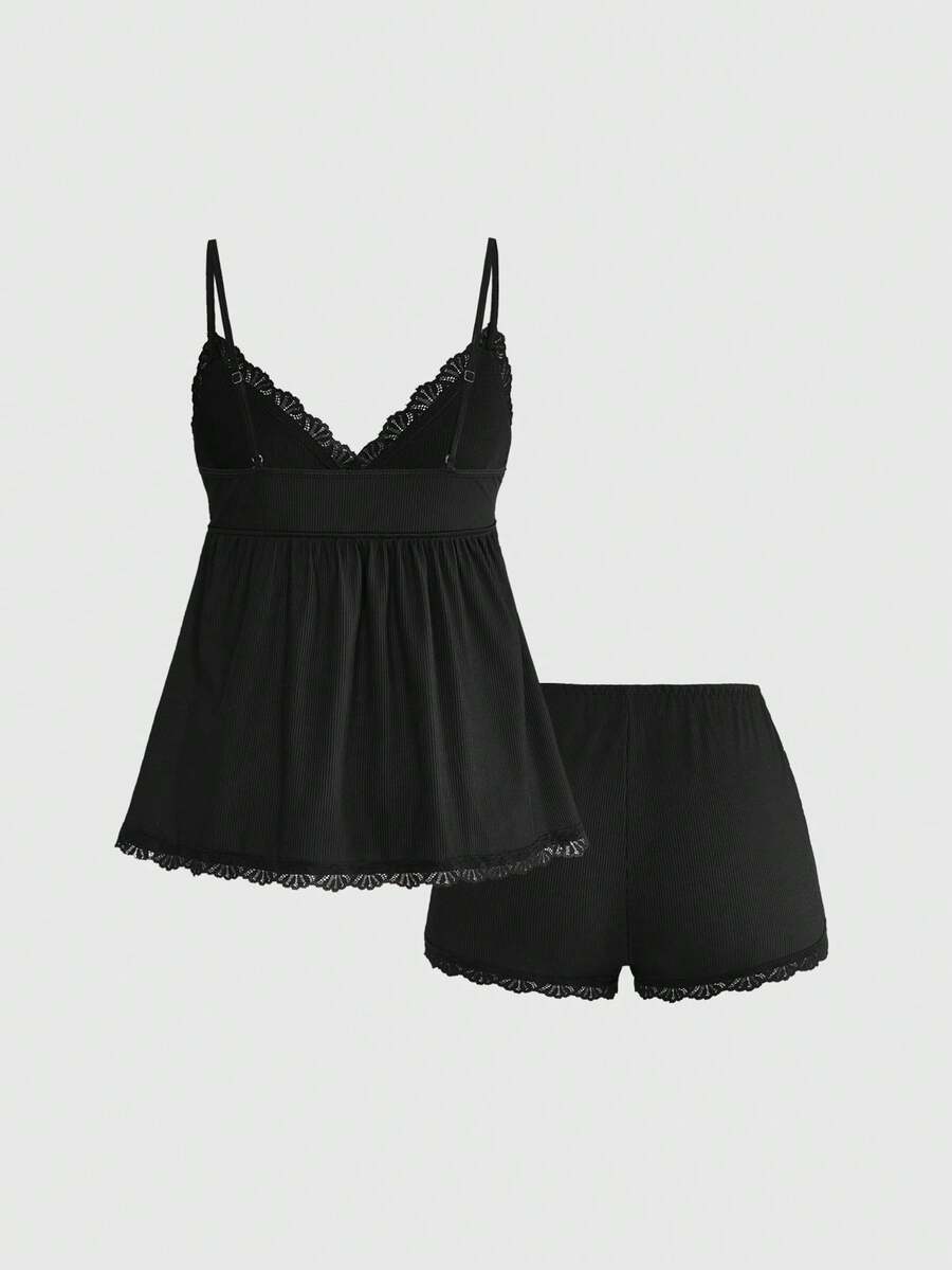 Ribbed lace camisole and shorts pajama set with spaghetti straps, bow detail, and contrast lace trim