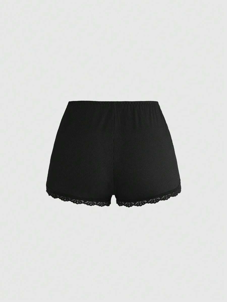 Ribbed lace camisole and shorts pajama set with spaghetti straps, bow detail, and contrast lace trim