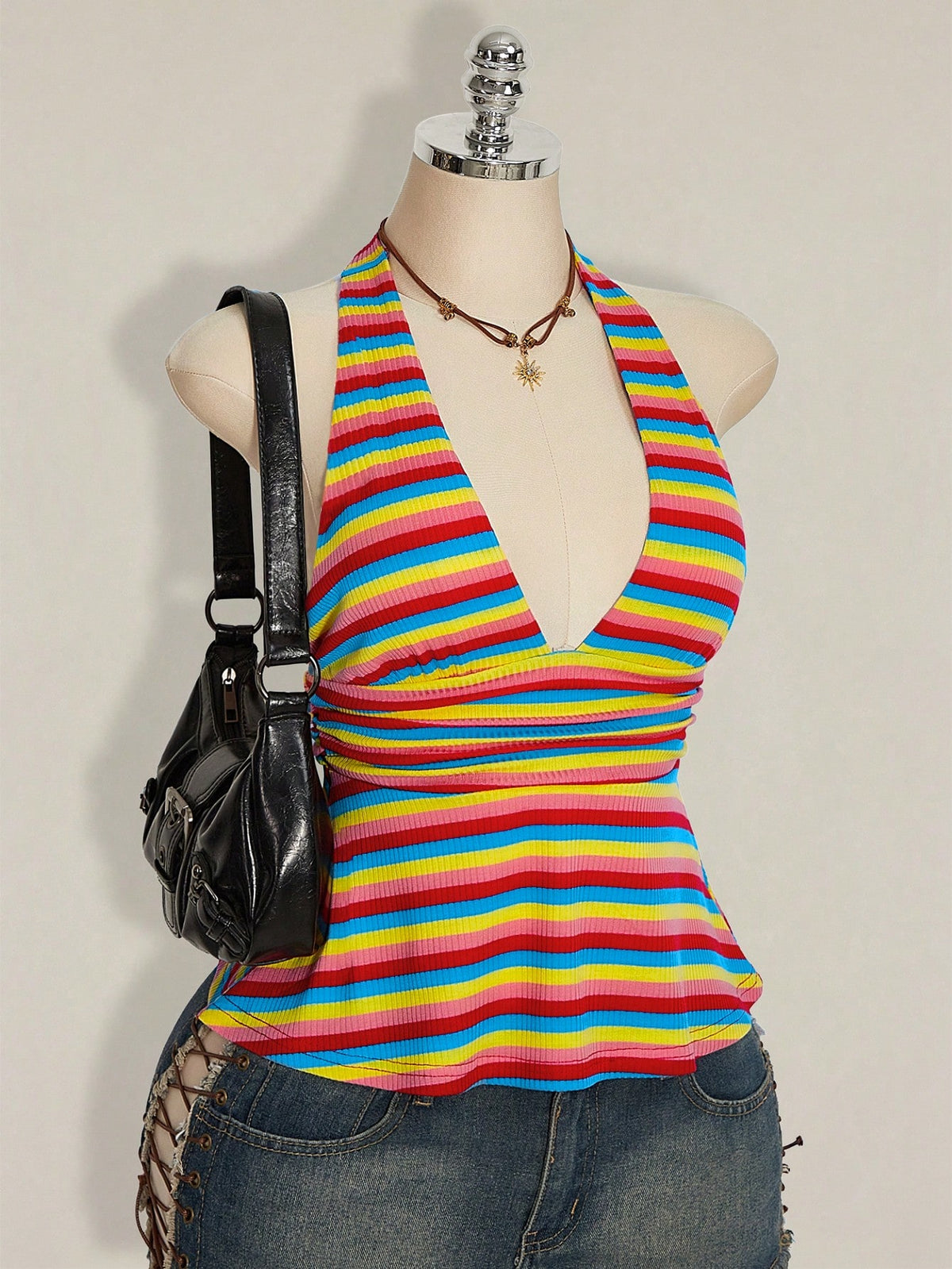 Women's backless halter babydoll tank top featuring a square neckline, slim fit silhouette, and a flared ruffle hem.