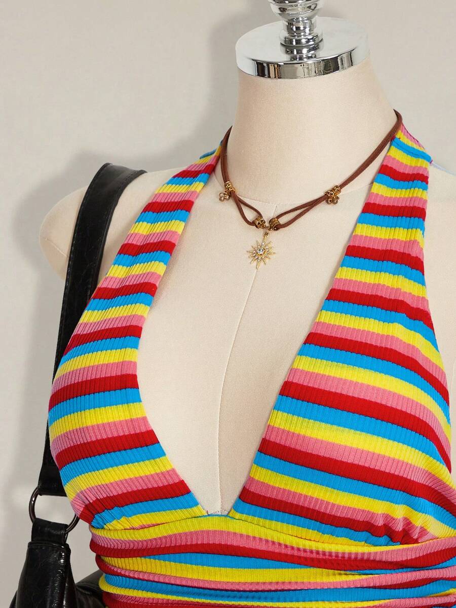 Women's backless halter babydoll tank top featuring a square neckline, slim fit silhouette, and a flared ruffle hem.