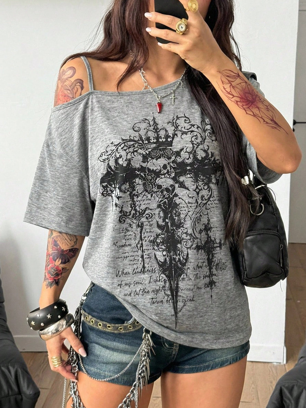 Women's casual loose fit cold shoulder cotton t-shirt with asymmetrical cutout neckline and short sleeves.