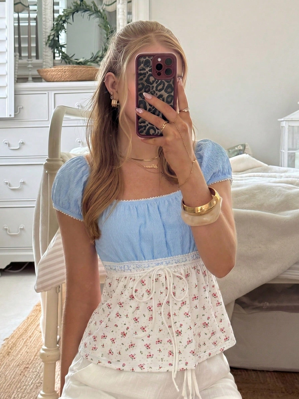 White ditsy floral women's square neck short sleeve t-shirt featuring puff sleeves, frill details, and a slim fit flared hem.
