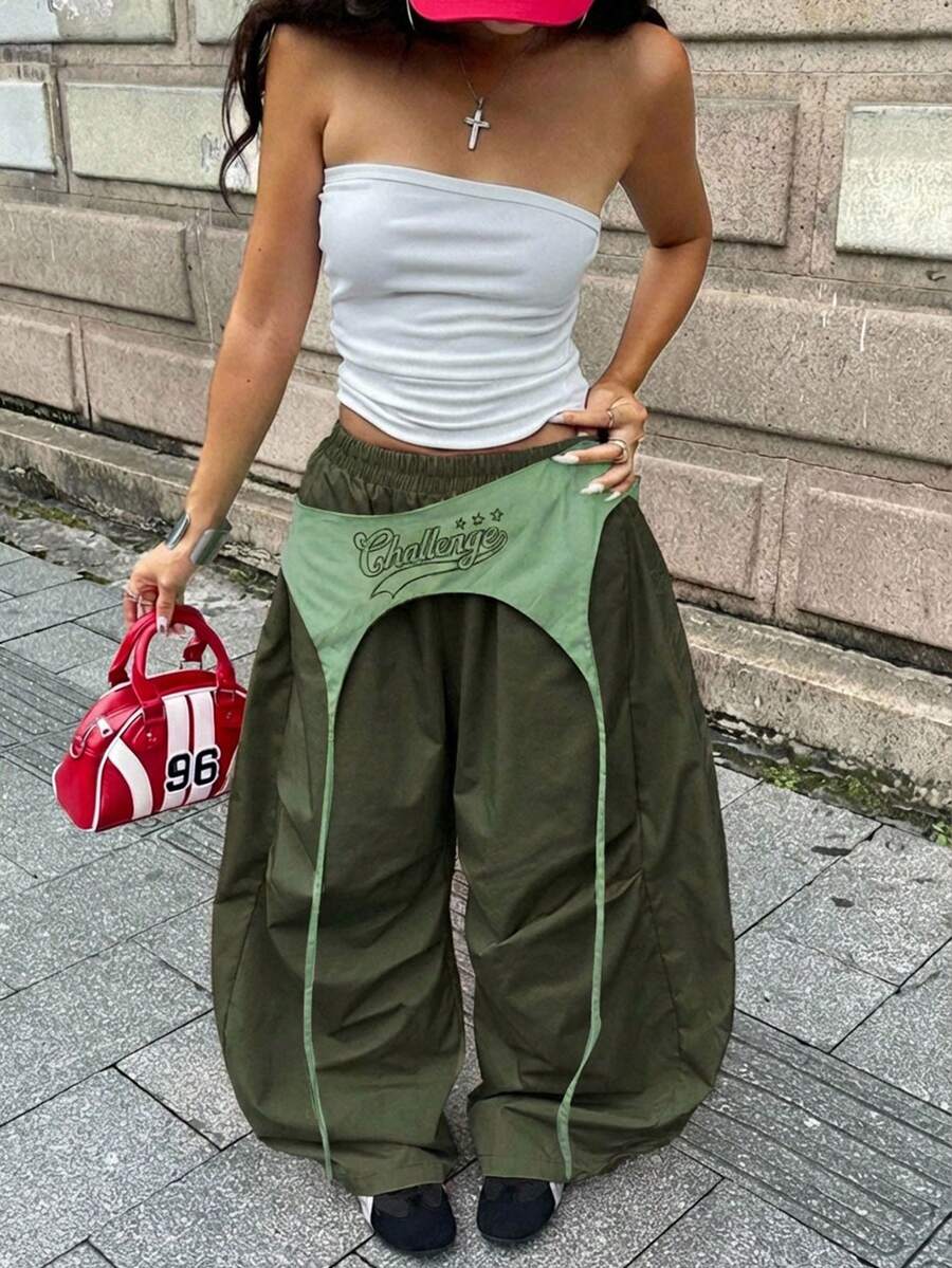 Women's casual wide leg long pants featuring an elastic drawstring waistband and loose fit silhouette.