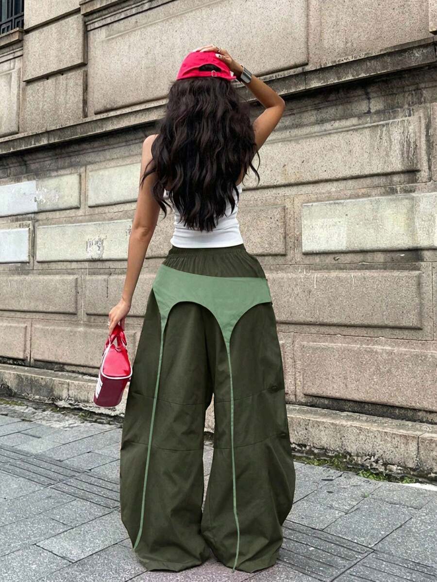 Women's casual wide leg long pants featuring an elastic drawstring waistband and loose fit silhouette.