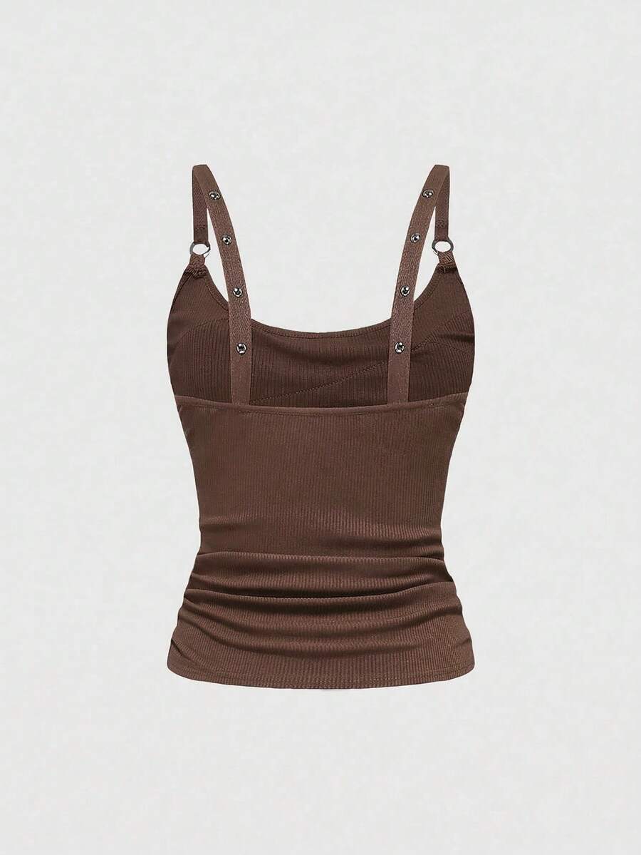 Women's wide-strap cami top featuring a grunge punk design with cut-out details, rhinestone embellishments, and grommet eyelets.
