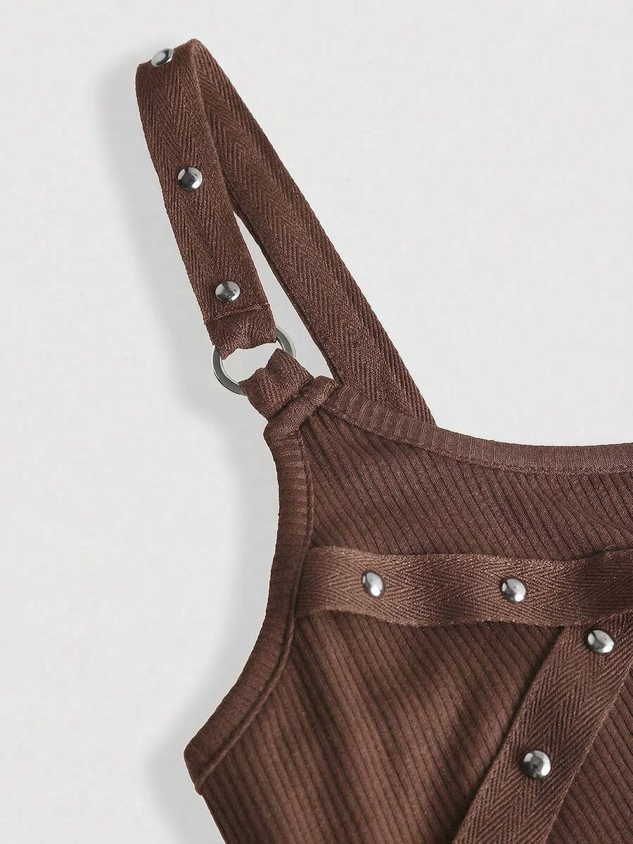 Women's wide-strap cami top featuring a grunge punk design with cut-out details, rhinestone embellishments, and grommet eyelets.