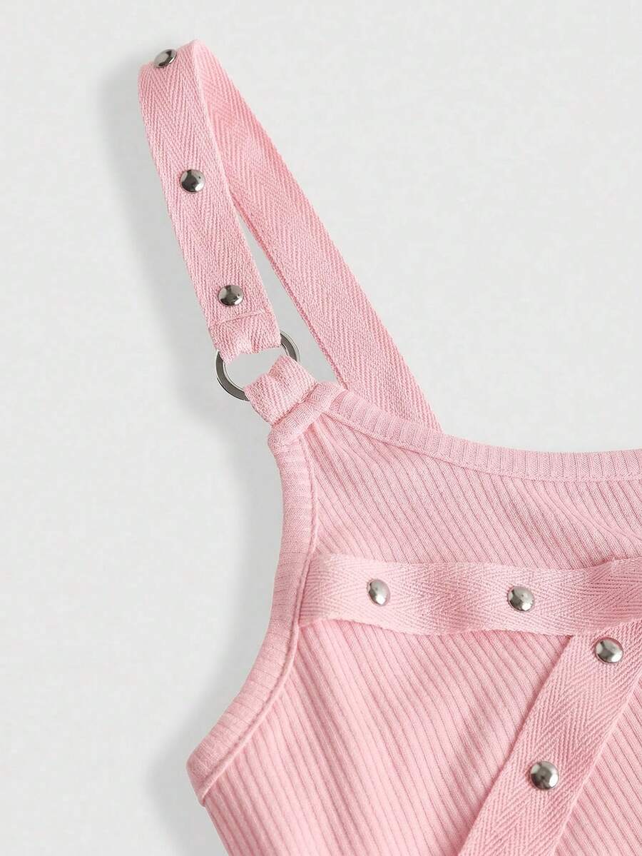 Women's wide-strap cami top featuring a grunge punk design with cut-out details, rhinestone embellishments, and grommet eyelets.