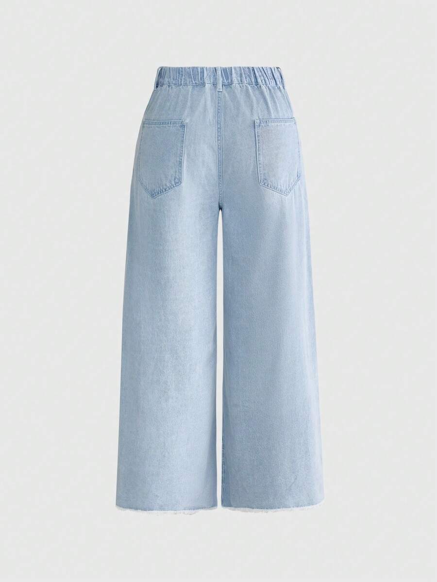 Women's plus size baby blue patchwork denim jeans featuring a loose straight leg cut, zipper fly, and pocket detailing.