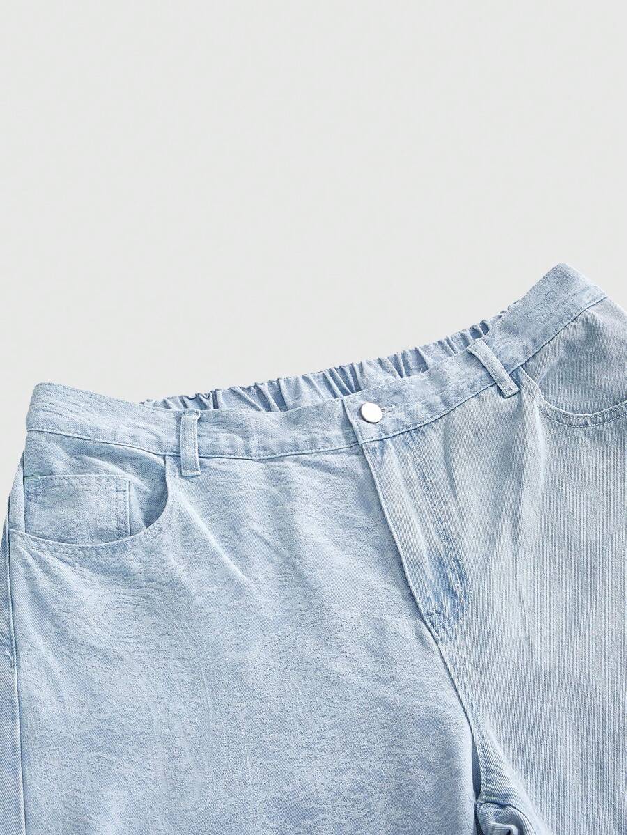 Women's plus size baby blue patchwork denim jeans featuring a loose straight leg cut, zipper fly, and pocket detailing.