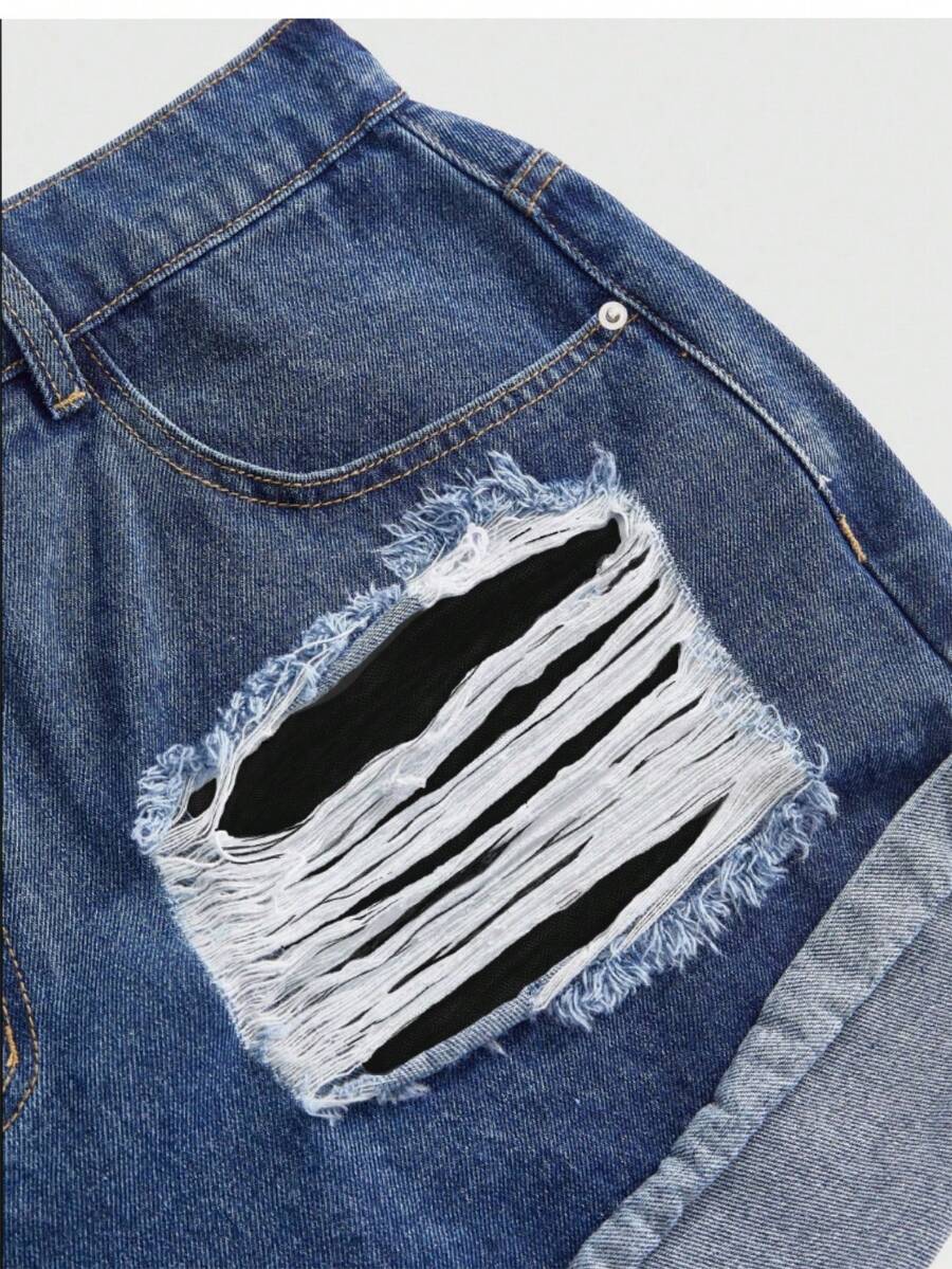 Front view of women's ripped denim shorts featuring raw hem, zipper fly, and pockets
