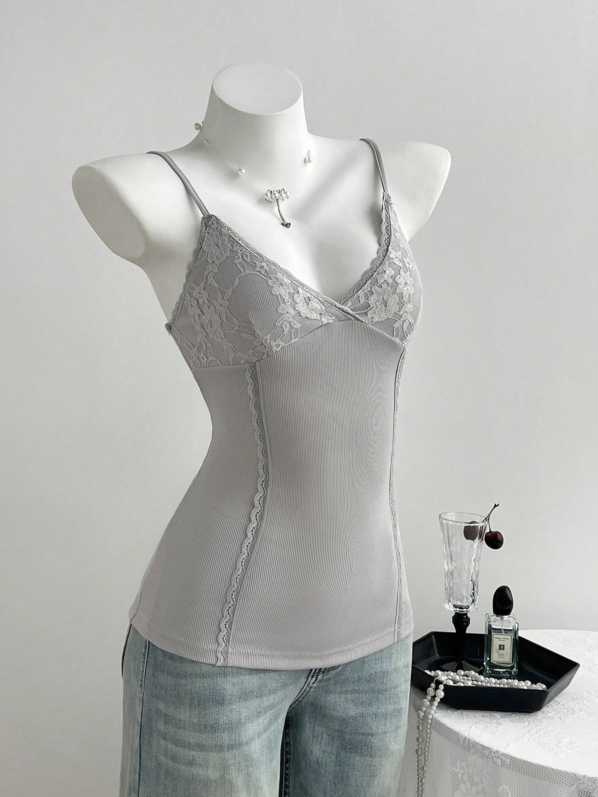 Women's slim fit backless cami tank top with contrast lace patchwork details, spaghetti straps, and high-stretch knitted ribbed fabric.