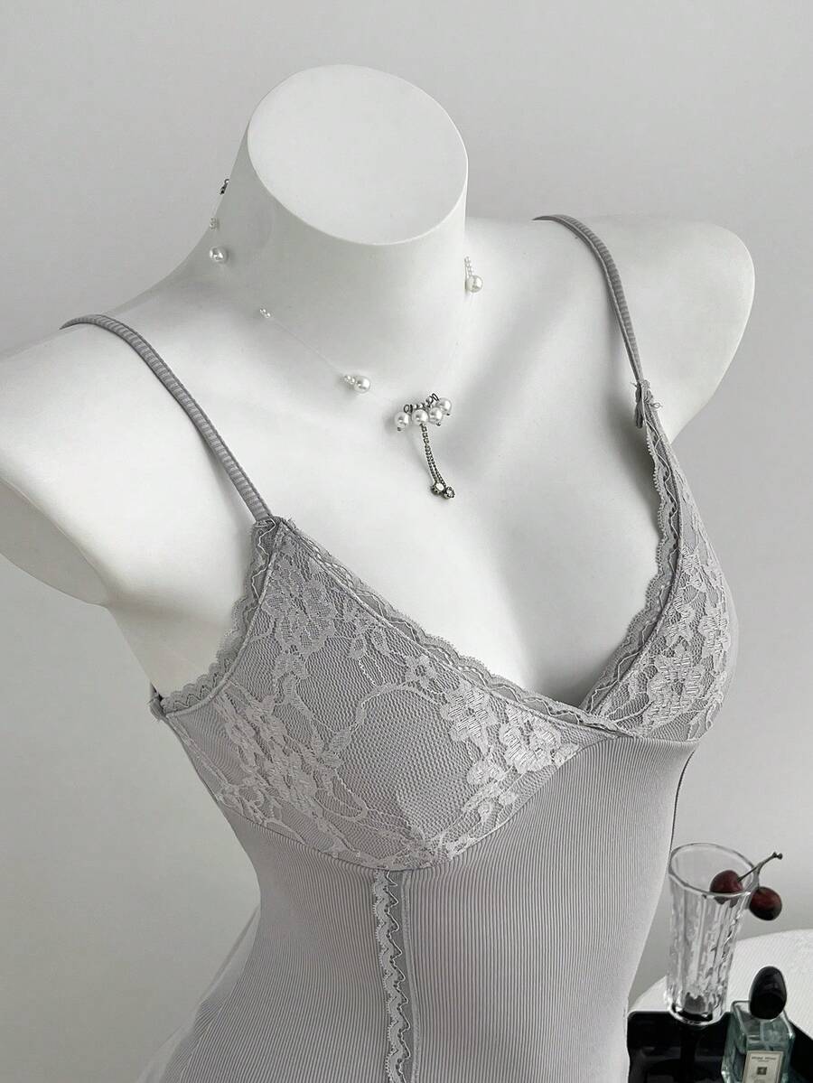 Women's slim fit backless cami tank top with contrast lace patchwork details, spaghetti straps, and high-stretch knitted ribbed fabric.